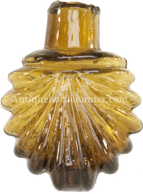 Scallop shell amber smelling bottle or scent. Height, 2 - 3/8 in. Width, 1 - 7/8 in. --- AntiqueBottleHunter.com