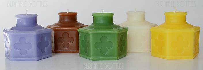 A group of CARTER'S (with four leaf clovers) ink bottle candles --- Burnable Bottles - AntiqueBottleHunter.com