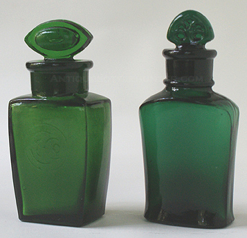 Two Colgate salts bottles - First, a yellow green embossed lightly in a circle is 'C & Co.' Right, is a dark emerald green that is base embossed: COLGATE & CO. over 27 over NEW YORK. Heights w/out stoppers, 2 - 3/4 in. and 3 in. --- AntiqueBottleHunter.com