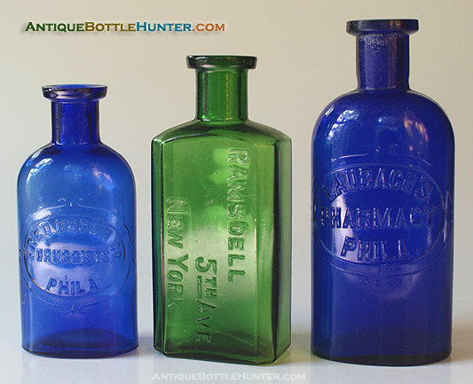 A blue FRED BROWN CO. / DRUGGISTS / PHILA. DRUG CO., a yellow green RAMSDELL / 5TH AVE. / NEW YORK and a blue LAUBACH'S / PHARMACY / PHILA. --- Antiquebottlehunter.com