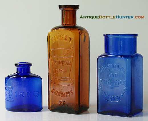A blue RIKER, a bubbly amber DICKEY CHEMIST S.F. and a square blue GROSVENOR AND RICHARDS / BOSTON & NEW YORK. (2 1/2 in., 5 1/2 in., and 4 in.) --- Antiquebottlehunter.com