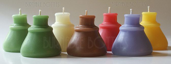A group of cone ink bottle candles --- Burnable Bottles - AntiqueBottleHunter.com