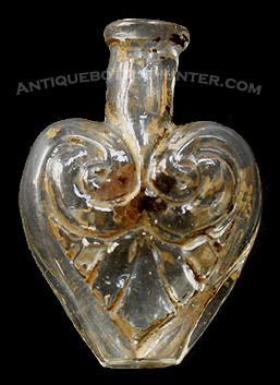 A heart shaped smelling bottle with gold paint - McK. plate 104 #8. Height, 2 - 3/16 in. --- AntiqueBottleHunter.com