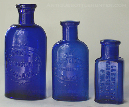 Three blue LLEWELLYN / CHESTNUT ST. / PHILAD'A. The middle one is from 1410, but the others are from 1518 Chestnut St. --- Antiquebottlehunter.com