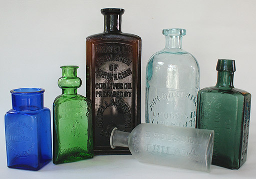 A GROUP OF MEDICINE BOTTLES