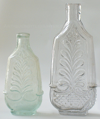 An aquamarine and taller colorless 'Plume and Column' cologne. (4 in. and 5 - 1/2 in.) --- AntiqueBottleHunter.com