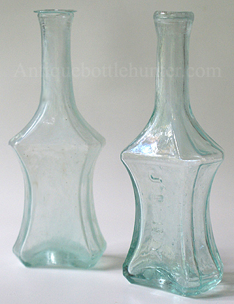 A couple of early aquamarine polygonal (8 sides) colognes. --- AntiqueBottleHunter.com