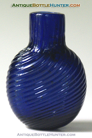 A deep cobalt blue short rounded form pattern molded smelling bottle --- AntiqueBottleHunter.com