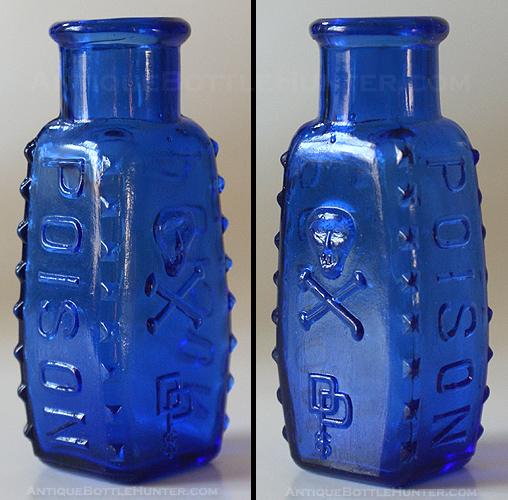 A cobalt coffin shaped KU-8 with skull and crossbones plus DP CO. --- Antiquebottlehunter.com