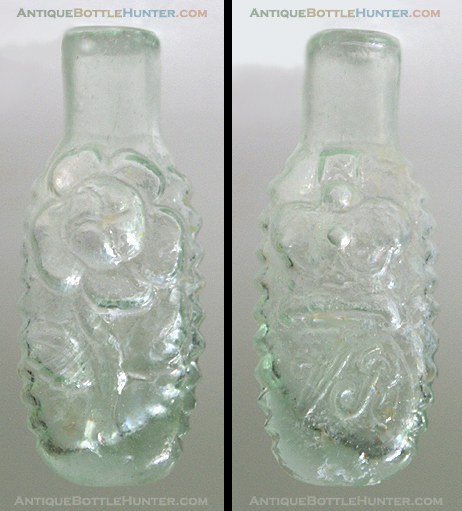 A light aquamarine VR - Crown - Flower embossed smelling bottle --- AntiqueBottleHunter.com